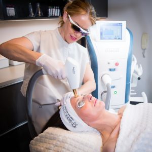 global-award winning advanced skin therapist, Martine Jarman, performing treatment
